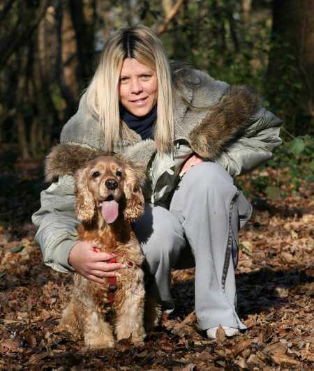 It's great to get out into the woods for a romp with your Cocker Spaniel Cocker spaniel and owner enjoying a romp in the forest.