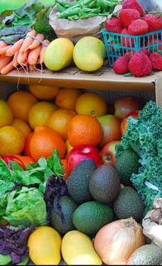 A selection of colourful fresh fruit and vegetables, organically grown without using pesticides.