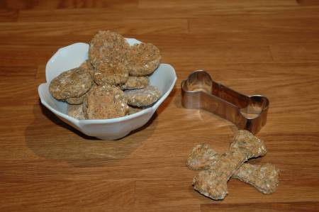 Beef and carrot homemade dog treats in a white bowl